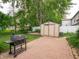 Spacious backyard featuring a grill, shed and patio at 4382 Castlebay Way, Indianapolis, IN 46254