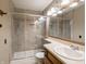 Bathroom featuring a glass shower, ceramic tiles, and a vanity sink at 4382 Castlebay Way, Indianapolis, IN 46254