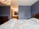 Bedroom featuring hardwood floors, a ceiling fan and access to an ensuite bathroom at 4382 Castlebay Way, Indianapolis, IN 46254