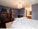 Bedroom featuring hardwood floors, a ceiling fan and access to an ensuite bathroom at 4382 Castlebay Way, Indianapolis, IN 46254