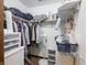 Organized closet with clothing racks, shelves, and storage bins at 4382 Castlebay Way, Indianapolis, IN 46254