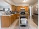 This kitchen has light cabinets, tile backsplash, and a stainless steel kitchen island at 4382 Castlebay Way, Indianapolis, IN 46254