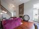 Bright living room with hardwood floors, fireplace, and staircase at 4382 Castlebay Way, Indianapolis, IN 46254