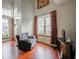 Living room with hardwood floors, natural light and a comfortable armchair at 4382 Castlebay Way, Indianapolis, IN 46254