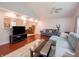 Open-concept living room featuring hardwood floors, recessed lighting, and comfortable couches at 4382 Castlebay Way, Indianapolis, IN 46254