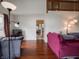 Open-concept living room with hardwood floors and a loft area at 4382 Castlebay Way, Indianapolis, IN 46254