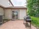 Outdoor patio with grill and sliding glass doors leading to the home's interior at 4382 Castlebay Way, Indianapolis, IN 46254