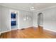 Dining room featuring hardwood floors, neutral paint, and doorway to the kitchen at 4641 Crittenden Ave, Indianapolis, IN 46205