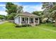 Inviting single-story home with a well-manicured lawn and classic architectural details at 4641 Crittenden Ave, Indianapolis, IN 46205