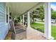 Covered front porch offering a tranquil outdoor seating area and neighborhood views at 4641 Crittenden Ave, Indianapolis, IN 46205