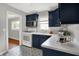 Updated kitchen features blue cabinets, modern appliances, and decorative tile floors at 4641 Crittenden Ave, Indianapolis, IN 46205