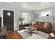 Stylish living room with modern decor, hardwood floors, and a comfortable seating area at 4641 Crittenden Ave, Indianapolis, IN 46205