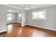 Open living room features hardwood floors, arched doorways, and natural light at 4641 Crittenden Ave, Indianapolis, IN 46205
