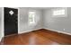 Bright and airy living room with hardwood floors and natural light from large windows at 4641 Crittenden Ave, Indianapolis, IN 46205
