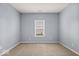Neutral bedroom featuring carpeted floors, ample natural light, and a serene atmosphere at 4736 Blue Marlin Way, Indianapolis, IN 46239
