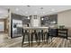 Contemporary kitchen showcasing stainless steel appliances, stylish cabinetry, and bar seating for casual dining at 4736 Blue Marlin Way, Indianapolis, IN 46239
