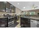 Well-appointed kitchen featuring stainless steel appliances, granite countertops and ample cabinet space at 4736 Blue Marlin Way, Indianapolis, IN 46239