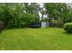 Expansive backyard with trampoline, shed and lush green lawn at 4751 N Longworth Ave, Indianapolis, IN 46226