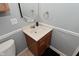 Cozy bathroom featuring oak vanity and medicine cabinet at 4751 N Longworth Ave, Indianapolis, IN 46226