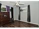 Spacious bedroom with a ceiling fan, closet, and a dresser at 4751 N Longworth Ave, Indianapolis, IN 46226