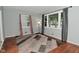 Bright living room with ample natural light, hardwood floors, and a stylish area rug at 4751 N Longworth Ave, Indianapolis, IN 46226