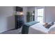 Comfortable bedroom with large window, TV, and dresser with plants at 488 Village Blvd, Mooresville, IN 46158