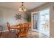 Cozy dining room with wooden table and chairs, chandelier, and natural light at 488 Village Blvd, Mooresville, IN 46158
