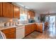 Well-equipped kitchen with wooden cabinets, practical layout, and plenty of natural light enhancing the space at 488 Village Blvd, Mooresville, IN 46158