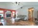 Open-concept living area with a fireplace and natural light creating a warm and inviting atmosphere at 488 Village Blvd, Mooresville, IN 46158