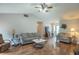 Bright living room with vaulted ceiling, hardwood floors, and comfortable seating arrangement at 488 Village Blvd, Mooresville, IN 46158