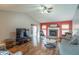 Bright living room with fireplace, offering a cozy atmosphere, plenty of seating, and ample natural light at 488 Village Blvd, Mooresville, IN 46158