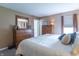 Bright main bedroom with ample natural light and wooden dresser at 488 Village Blvd, Mooresville, IN 46158
