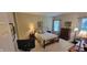 Bedroom features neutral walls, wood dresser, and windows with natural light at 5189 Bally Bunion Dr, Avon, IN 46123