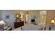 Bedroom featuring neutral walls, wood dresser, and ensuite access to bathroom at 5189 Bally Bunion Dr, Avon, IN 46123