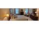 Comfortable bedroom featuring a large bed, dresser, and windows with natural light at 5189 Bally Bunion Dr, Avon, IN 46123