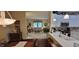 Open-concept kitchen with a breakfast bar overlooking the living room at 5189 Bally Bunion Dr, Avon, IN 46123