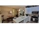 Modern kitchen featuring white cabinets, stainless steel appliances, and an open layout to the dining area at 5189 Bally Bunion Dr, Avon, IN 46123