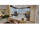 Bright kitchen with white cabinets, stainless steel appliances, and a breakfast bar open to the living area at 5189 Bally Bunion Dr, Avon, IN 46123