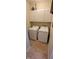 Functional laundry room with white appliances and overhead cabinets for optimal storage and organization at 5189 Bally Bunion Dr, Avon, IN 46123