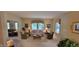 Living room featuring neutral walls, large windows, and comfortable seating arrangements at 5189 Bally Bunion Dr, Avon, IN 46123
