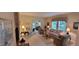 Inviting living room with large windows, neutral walls, and stylish furnishings at 5189 Bally Bunion Dr, Avon, IN 46123