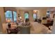 Open-concept living room with neutral walls, cozy furniture, and ample natural light at 5189 Bally Bunion Dr, Avon, IN 46123
