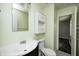 Light and bright bathroom with modern fixtures, single sink, and ample storage at 5401 Padre Ln, Indianapolis, IN 46237