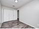 A light and bright bedroom with modern gray flooring and neutral color palette at 5401 Padre Ln, Indianapolis, IN 46237