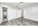 A bright bedroom features modern gray flooring and a neutral color palette at 5401 Padre Ln, Indianapolis, IN 46237