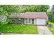 Charming single-story home with classic design elements and a well-maintained front yard at 5401 Padre Ln, Indianapolis, IN 46237