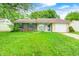 Charming single-story home with a well-manicured lawn, attached garage, and inviting curb appeal at 5401 Padre Ln, Indianapolis, IN 46237