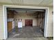 Open garage offers ample storage space with custom shelving and has a convenient access point to the house at 5401 Padre Ln, Indianapolis, IN 46237