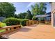A spacious deck overlooks the expansive lawn and landscaped backyard of this home at 567 Hawthorne Dr, Carmel, IN 46033