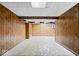 Unfinished basement with paneling and concrete floor at 567 Hawthorne Dr, Carmel, IN 46033